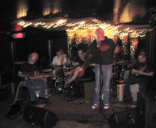 Mia playing electric harp with the Hanuman Sextet John Sinclair reciting poetry with the Hanaman Sextet